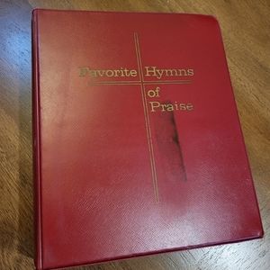 Vintage Favorite Hymns of Praise in loose leaf notebook.